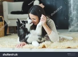 stock-photo-portrait-of-woman-with-dog-524212318
